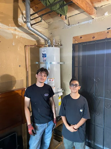 Alberto's two kids by a completed Premier Plumbing Solutions 925 water heater installation in Brentwood CA