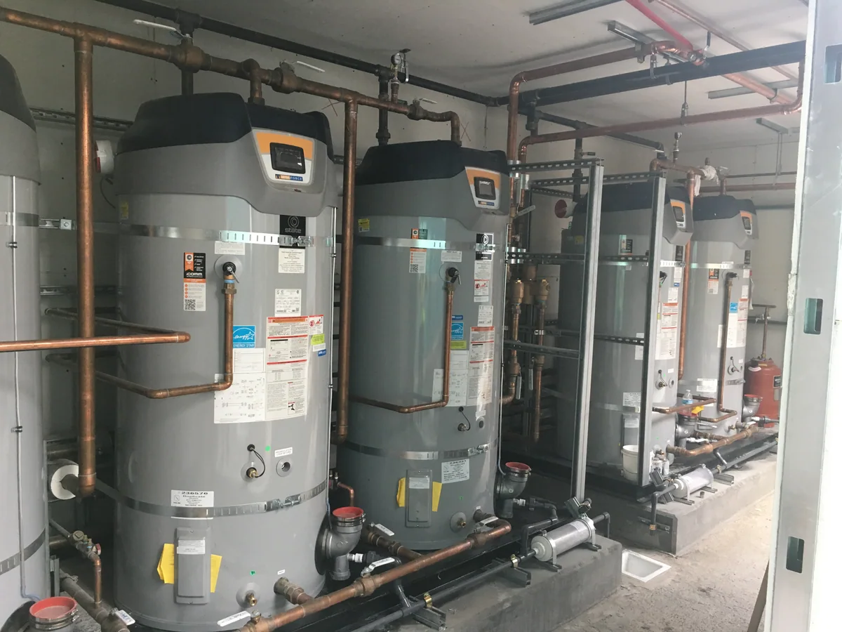 Large water heater system with copper piping by Premier Plumbing Solutions 925