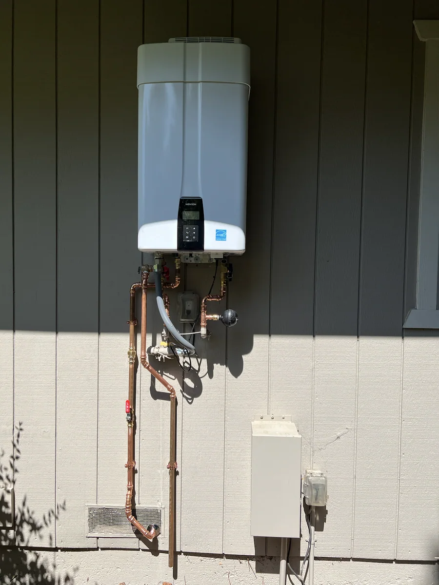 Exterior tankless water heater installation by Premier Plumbing Solutions 925