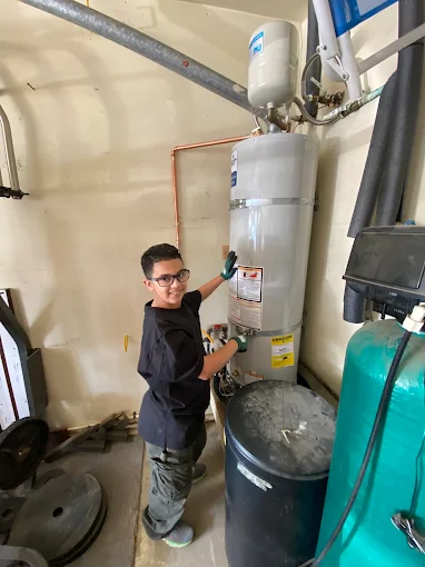 Alberto's child helping with a Premier Plumbing Solutions 925 water heater service in Brentwood CA