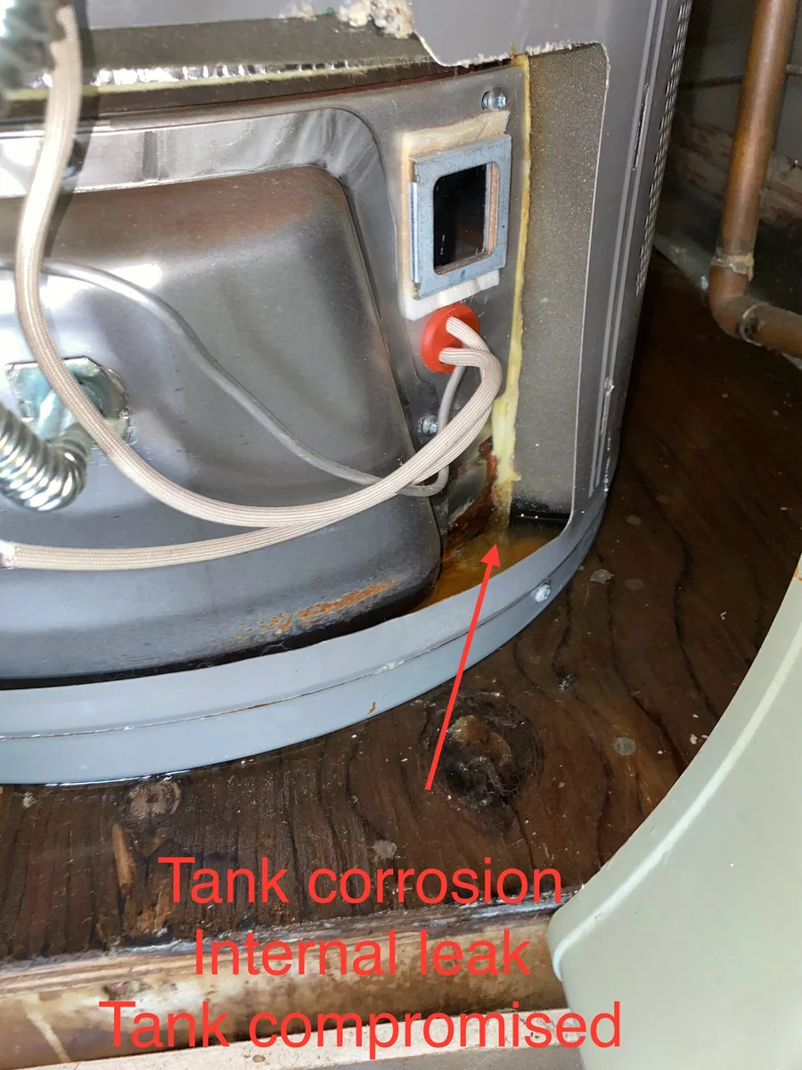 Rust and leak damage at a water heater tank inspected by Premier Plumbing Solutions 925