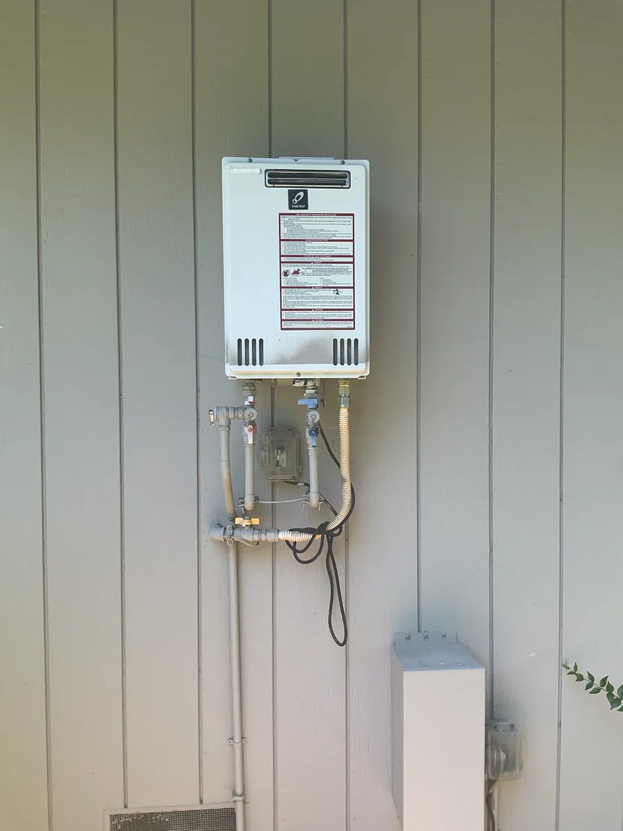 Wall mounted tankless water heater installation by Premier Plumbing Solutions 925